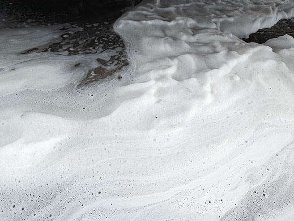 Abstract image of white firefighting foam containing PFAS